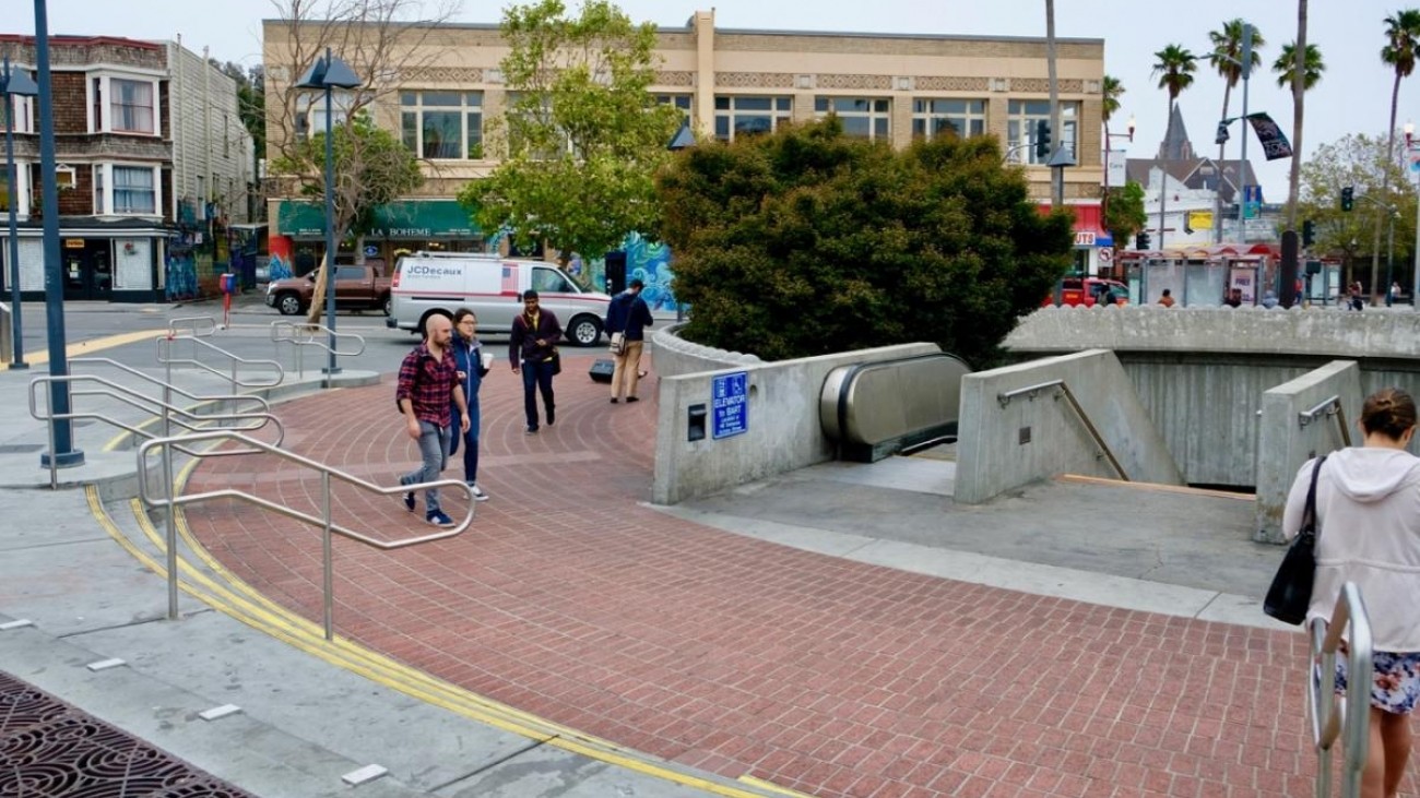 Riders enter the redesigned BART plaza at the 24th Street/Mission Station.