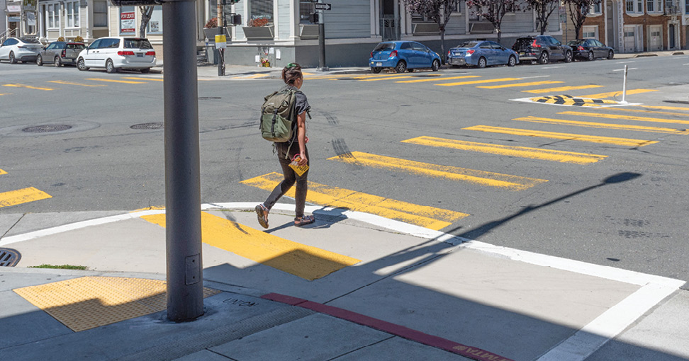 A painted area of pavement adjacent to the sidewalk