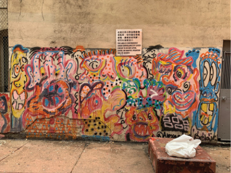 A colorful, abstract mural made with spray paint.