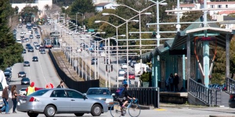 People cross 19th Avenue at Holloway