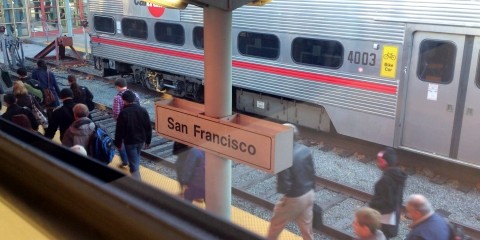 Passengers walk through Caltrain's 4th & King station