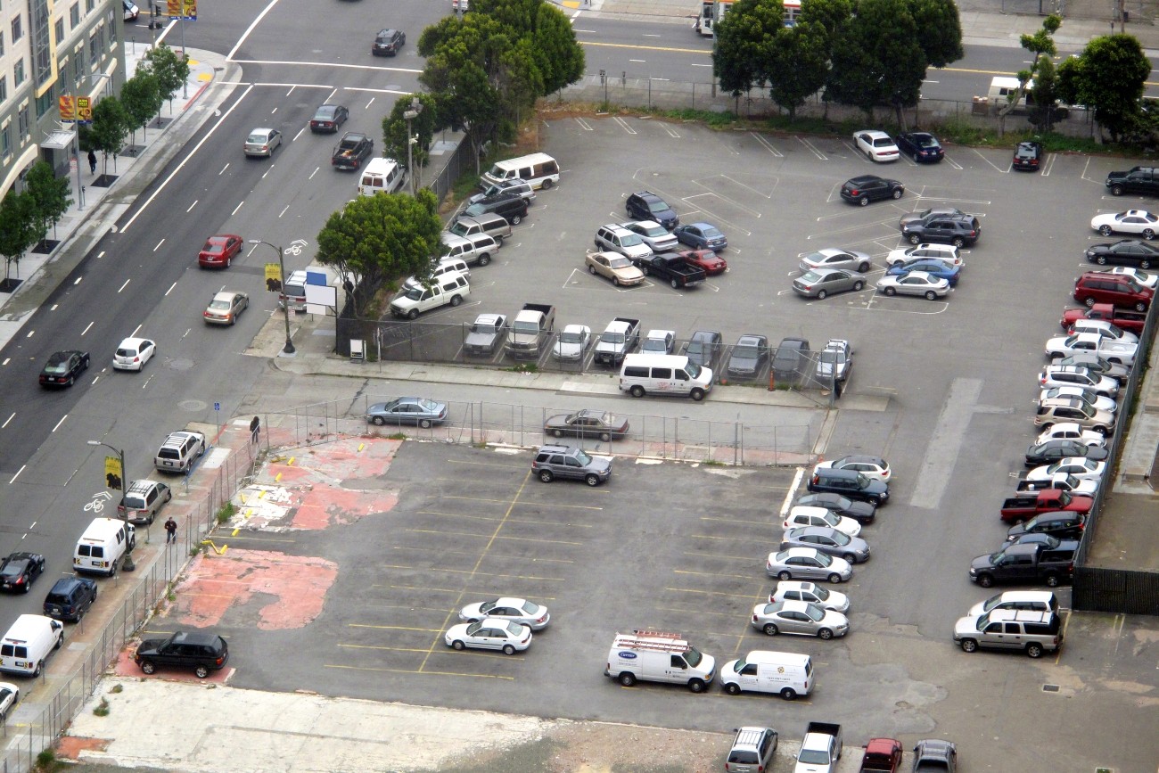 A parking lot with many empty spaces