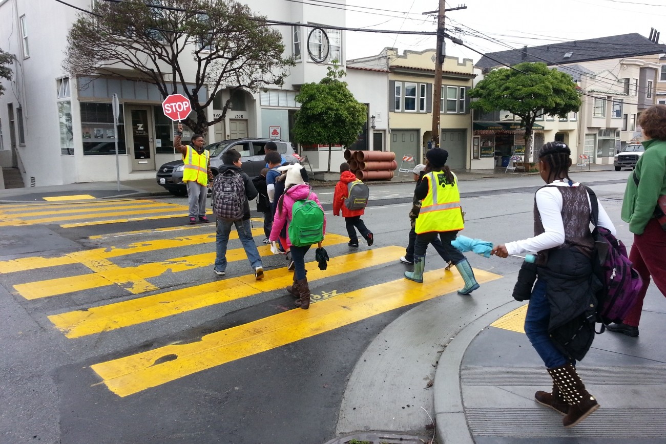 Kids crossing the street with a crossing guard at 20th and Connecticut streets