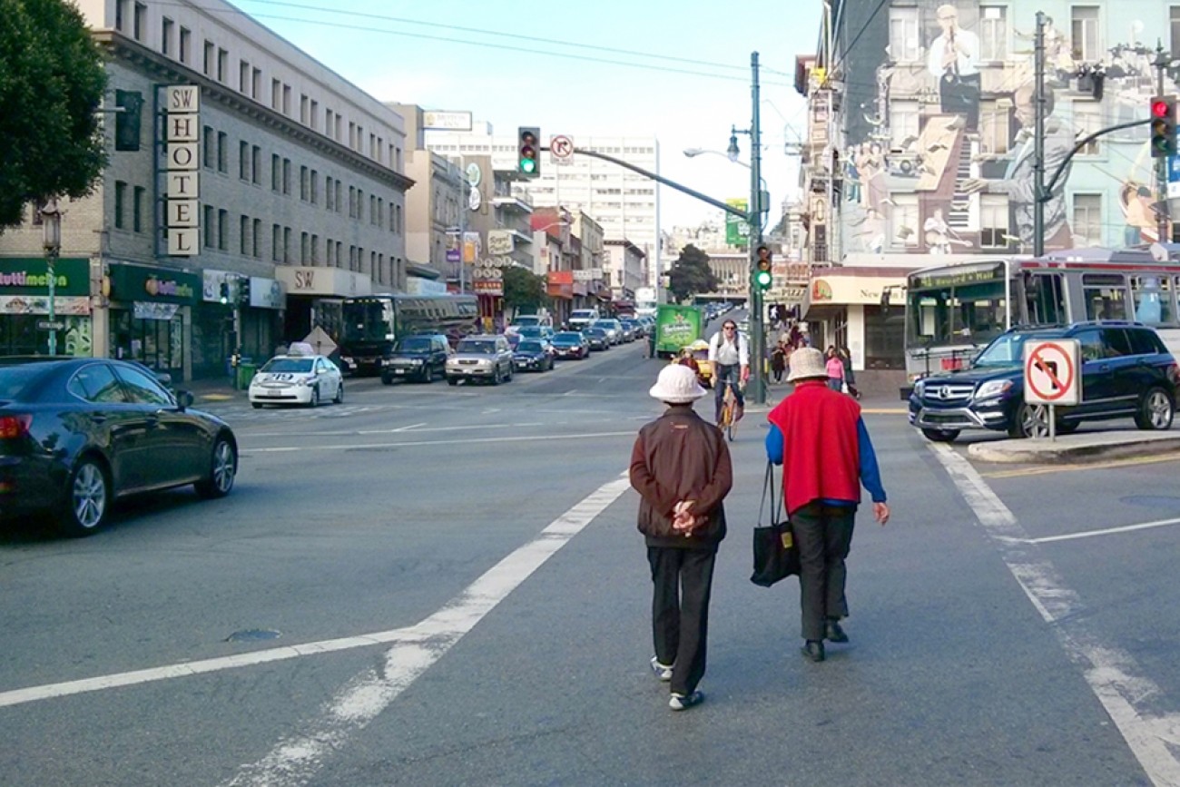 People in a Chinatown crosswalk