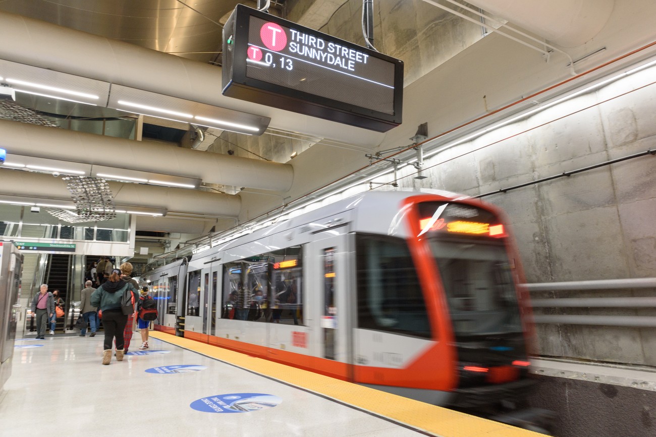 A train heading to "Third Street / Sunnydale" pulls in to a Central Subway underground station.
