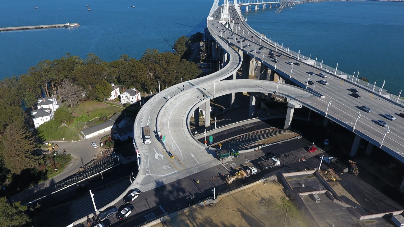 an aerial image of a freeway ramp existing the Bay Bridge 