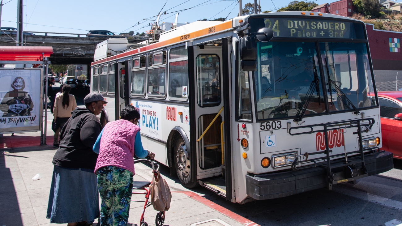 People boarding a 24 bus in the Bayview