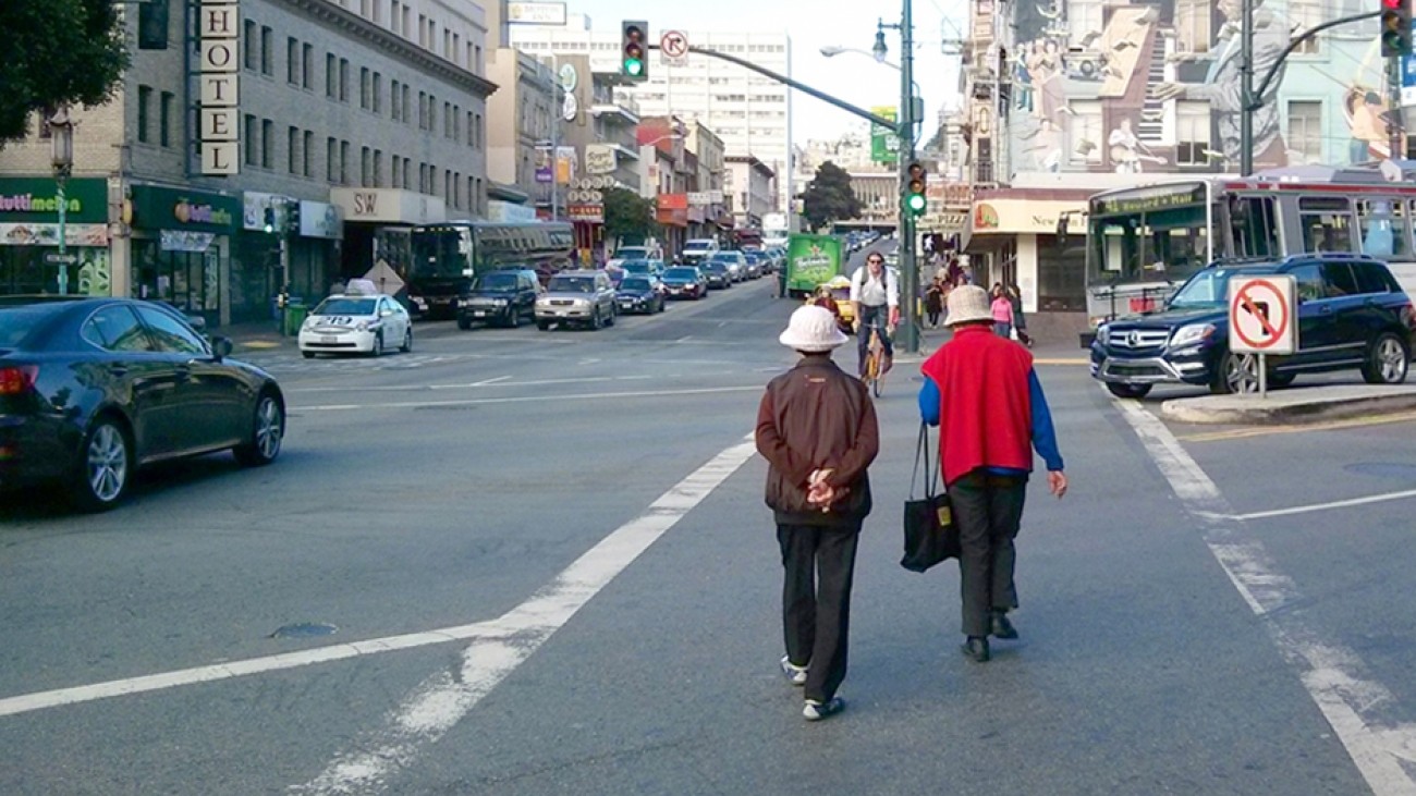 People in a Chinatown crosswalk