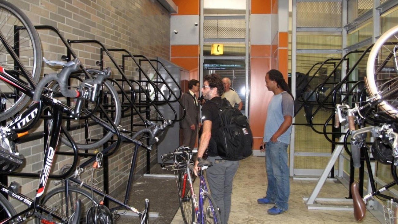 Multimodal commuters make use of the new Civic Center BART/Muni bicycle station