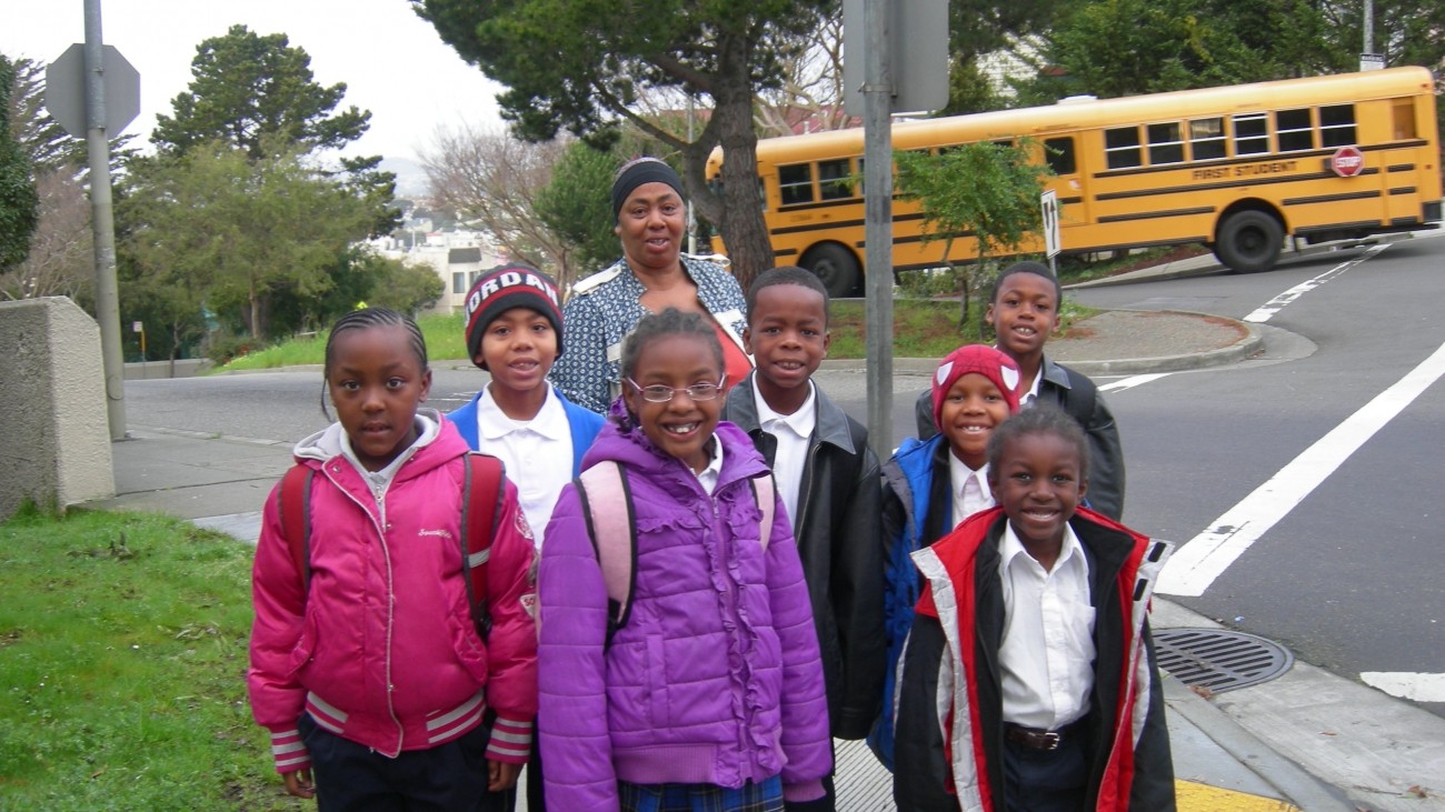 A group of children walking to school as part of a walking school bus