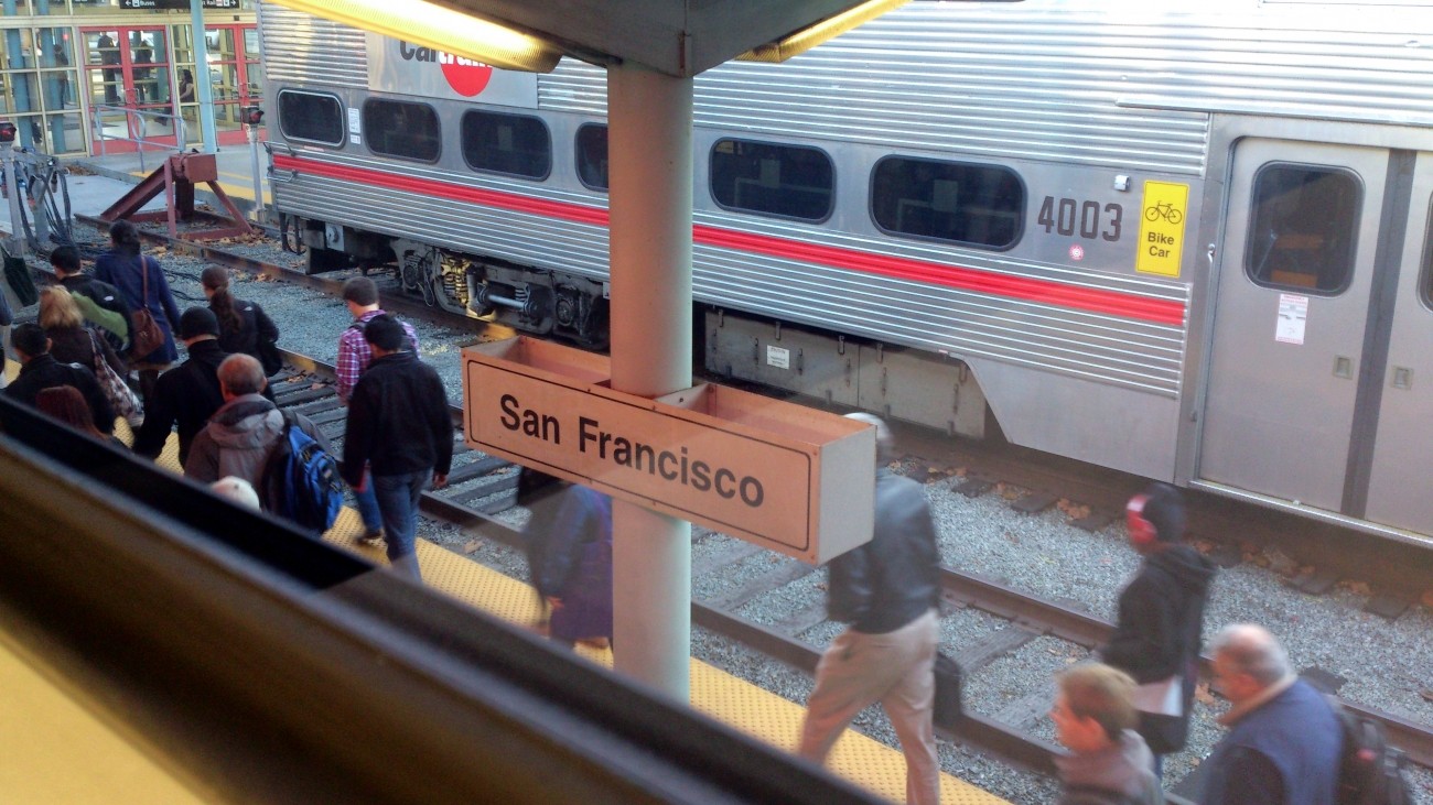 Passengers walk through Caltrain's 4th & King station