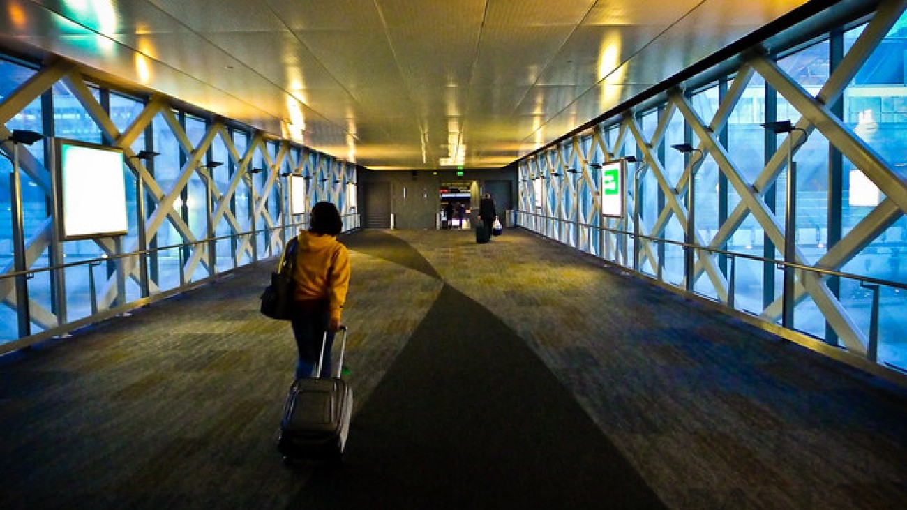 A woman with a suitcase at SFO