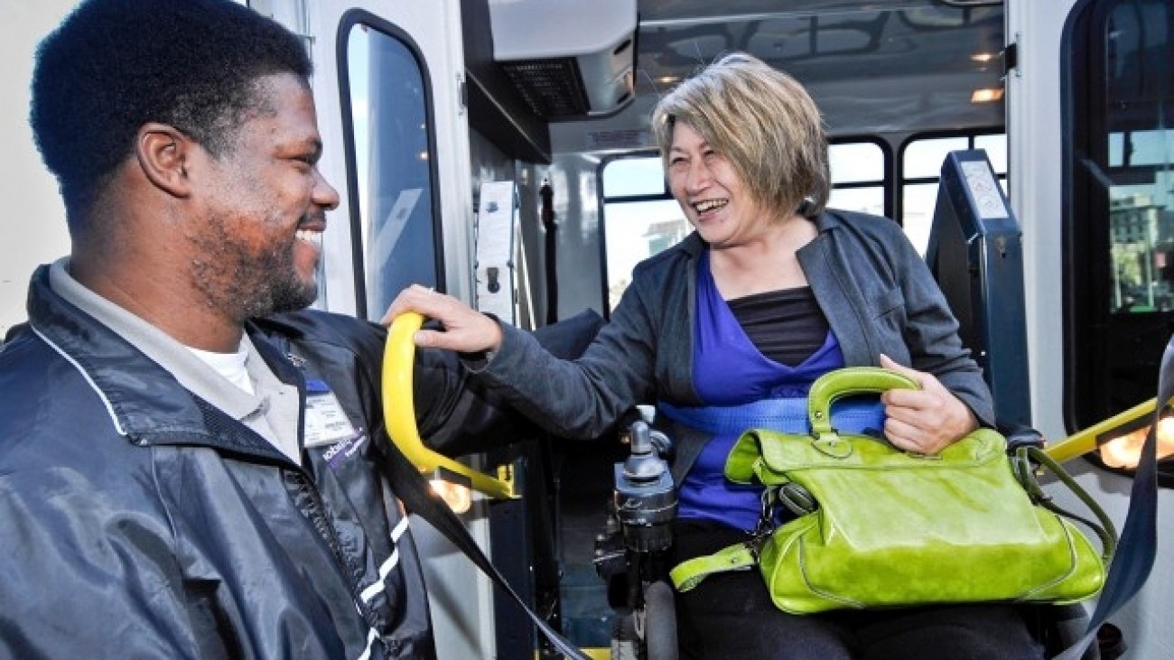 A woman in a wheelchair using the Shopper Shuttle