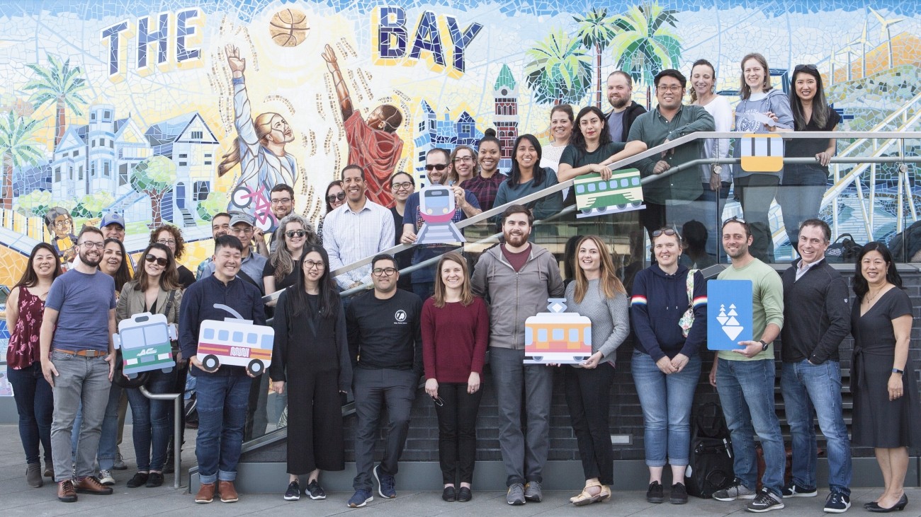 A group photo of ~40 Transportation Authority staff members together outdoors 