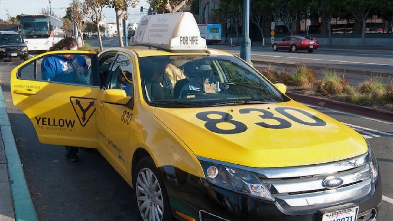 people entering a taxi