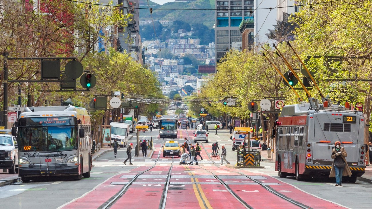 Market Street, with buses and people walking and biking