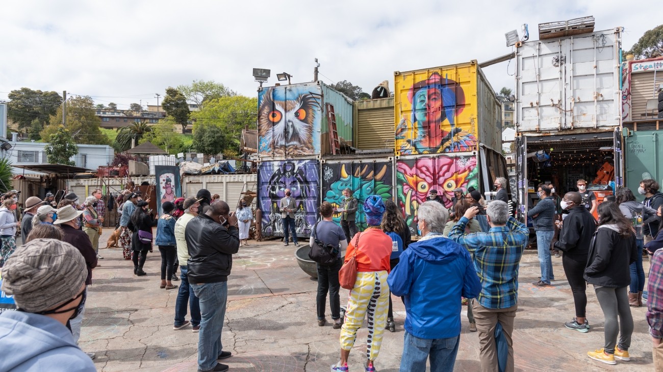 Photo of community gathered at the Box Shop to celebrate the completion of the Bayview Quick-Builds project