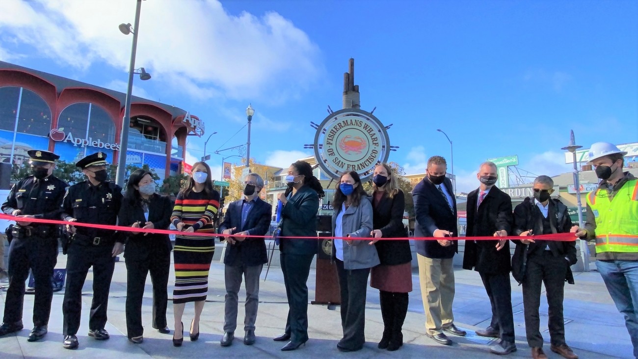 City officials, transportation agency staff, and community members gathered for the ribbon cutting ceremony at Fisherman's Wharf