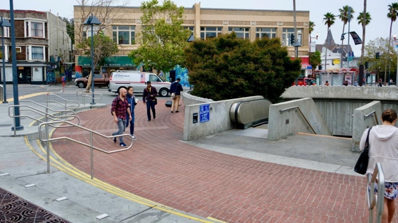 People walking in front of the 24th Street Station.