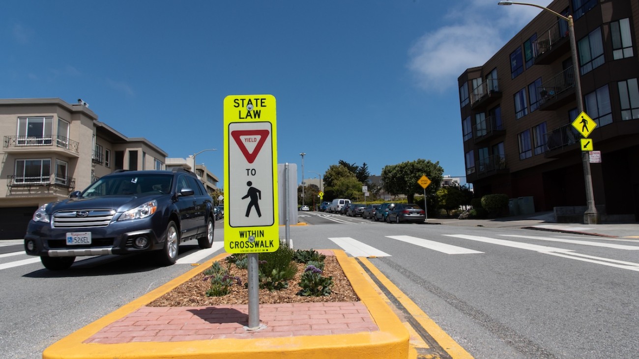 Traffic island in the middle of a crosswalk