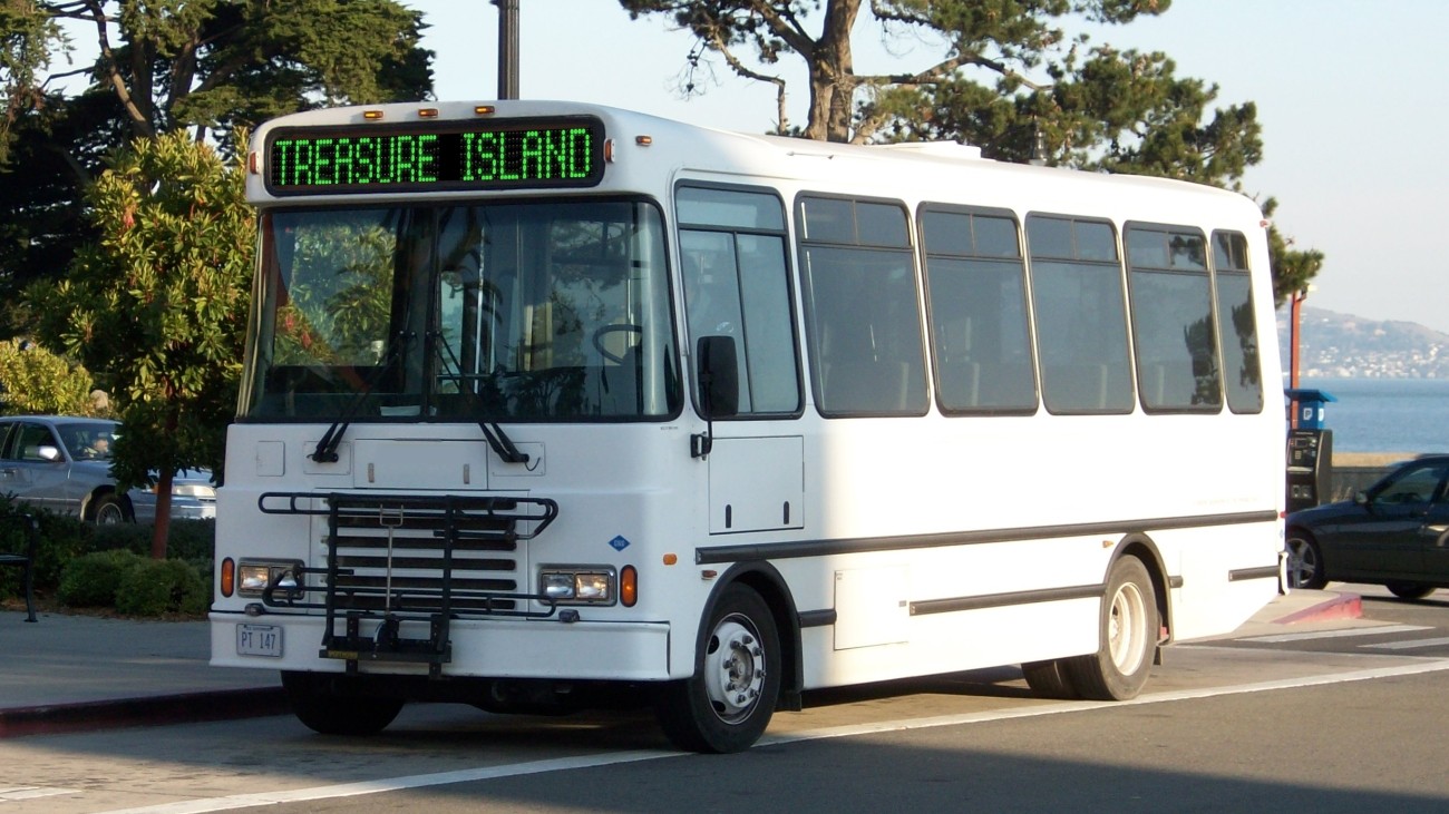 A rendering of a small shuttle bus with "Treasure Island" on the destination sign.