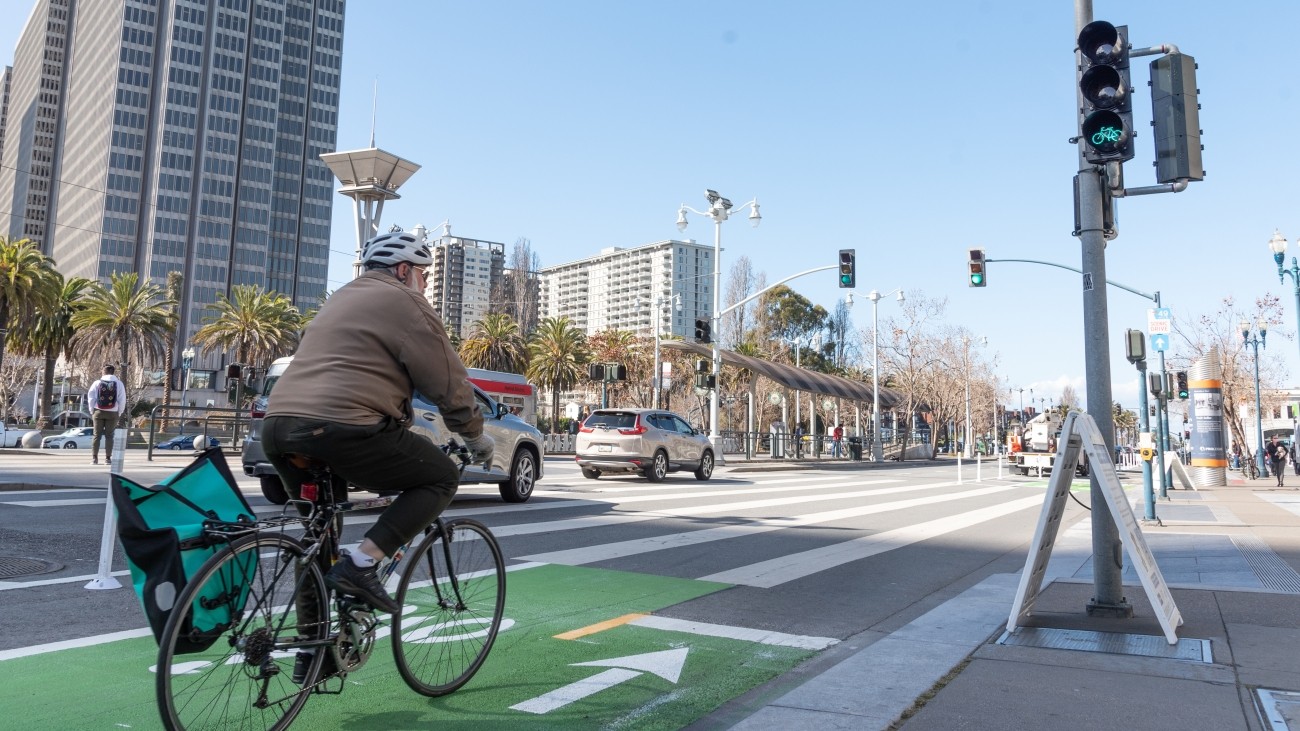 Person on biking on bike lane along Embarcadero