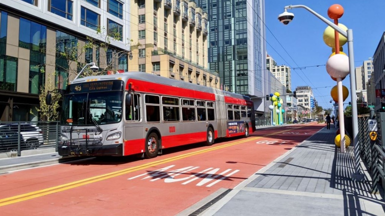Photo of Van Ness bus in bus-only lane at a station