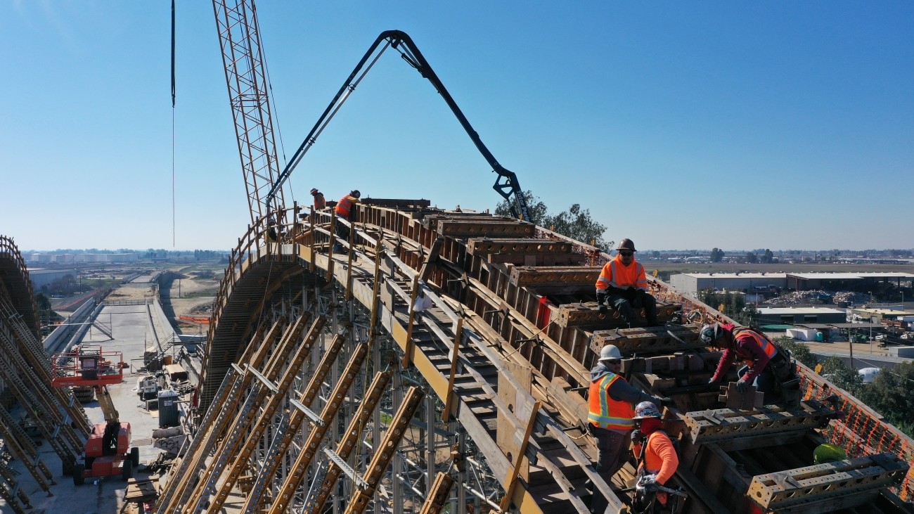 Workers constructing transportation infrastructure