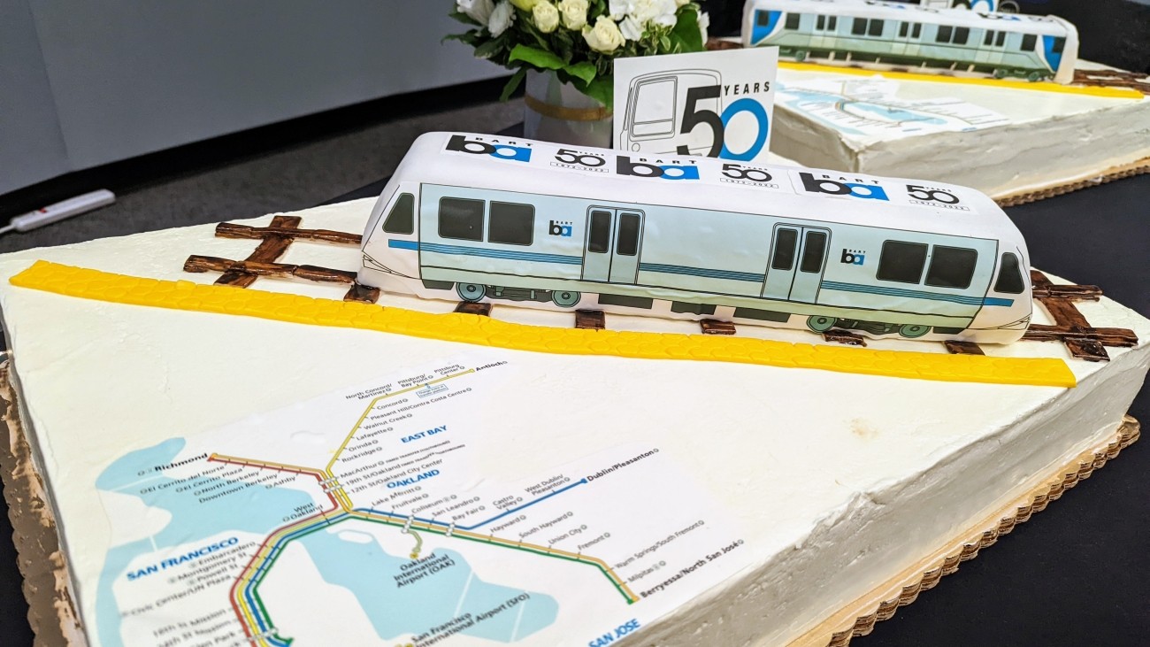 Two BART cakes with maps and 3-D trains