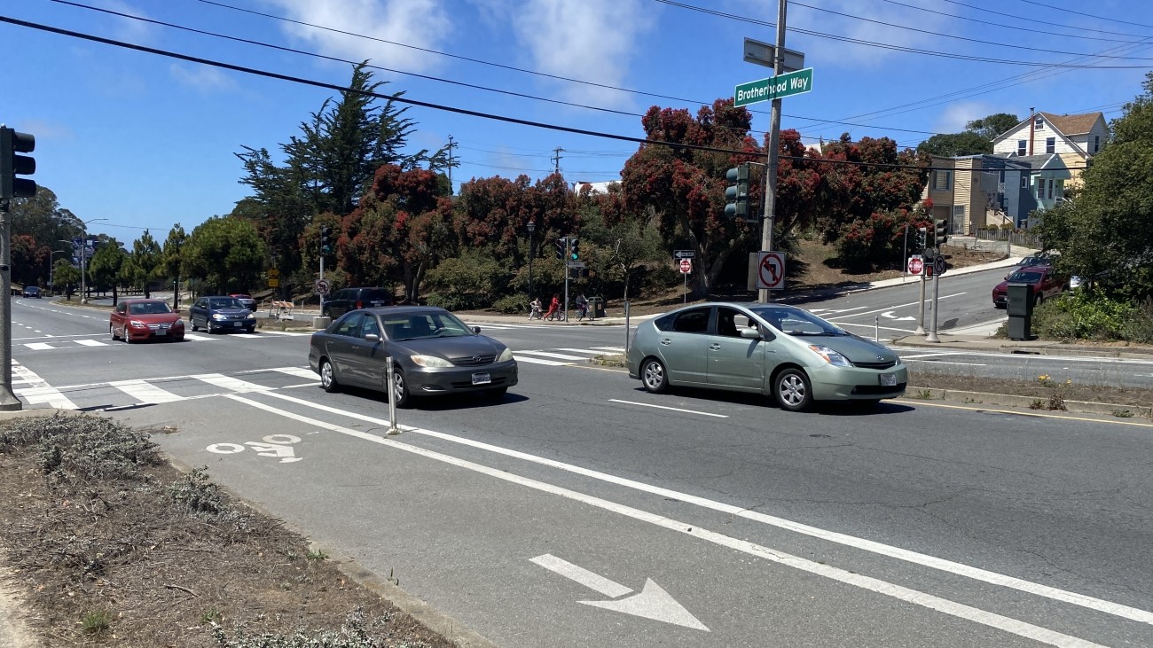 Vehicles driving along Brotherhood Way