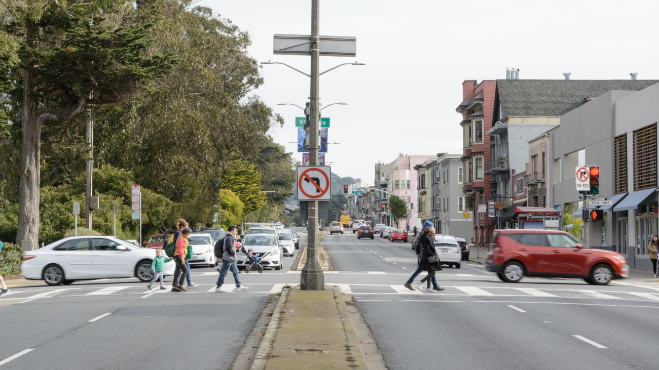 Pedestrians crossing in crosswalk along Lincoln Avenue