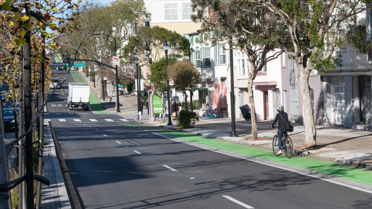 Bicyclist riding on repaved Masonic Ave. 