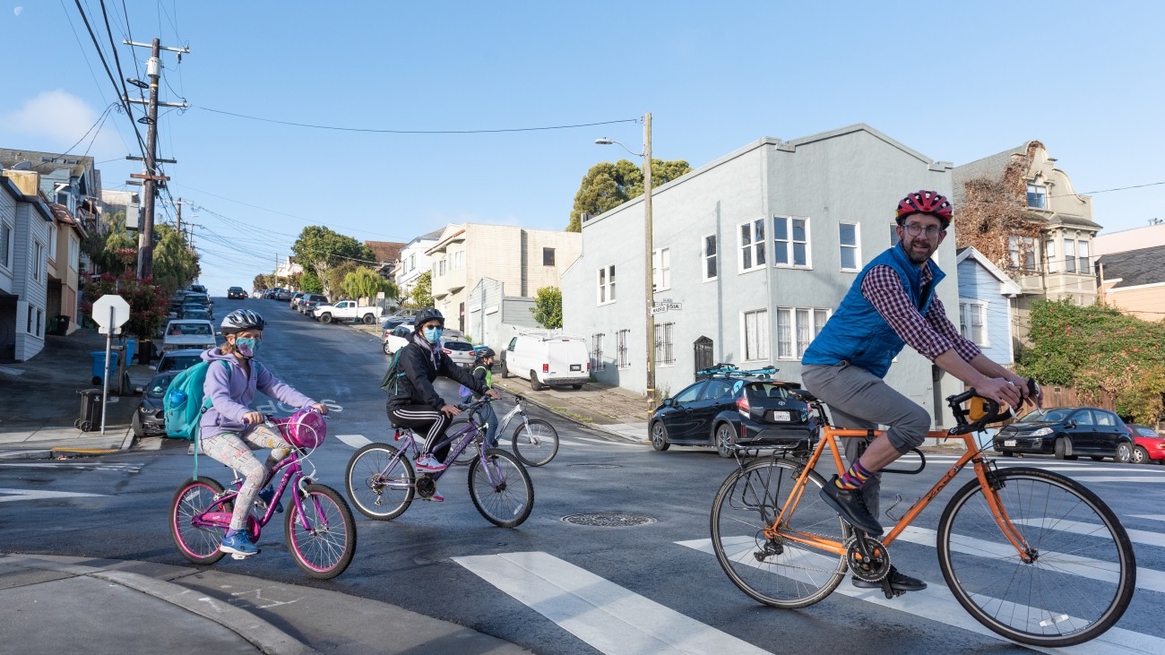 Adult and children biking in the Excelsior neighborhood