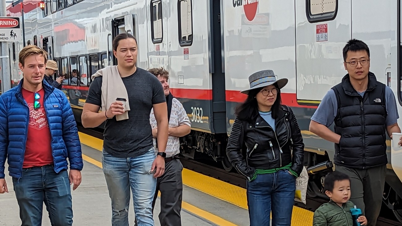 Members of the public walking alongside the new train. 
