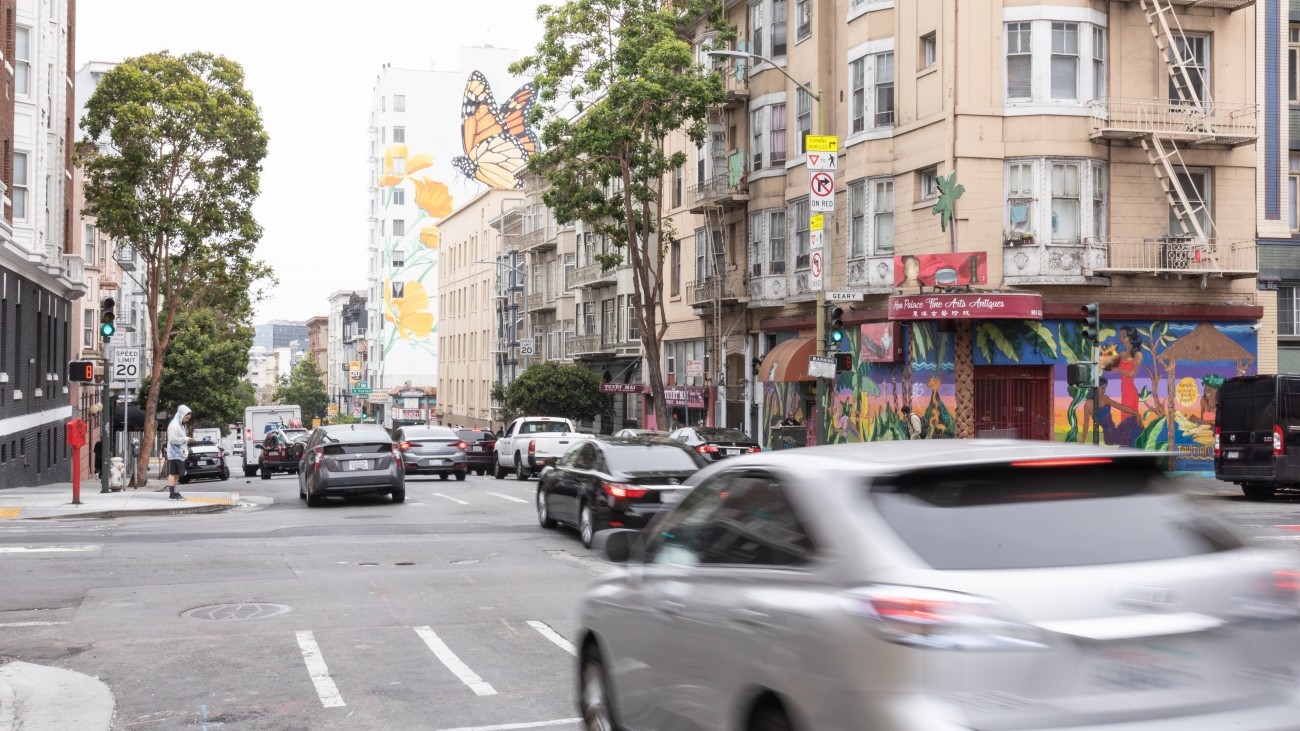 A blurred vehicle in motion driving through Hyde Street