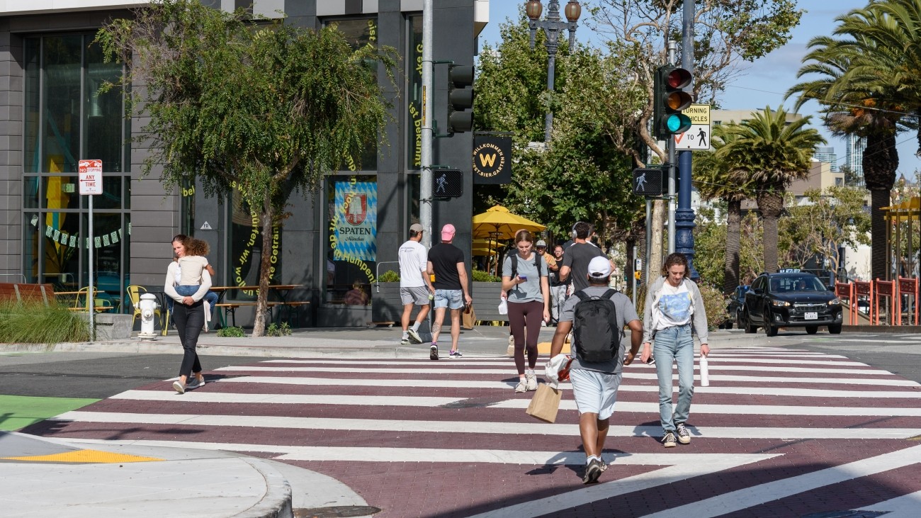 Pedestrians walking in crosswalk along Market Street