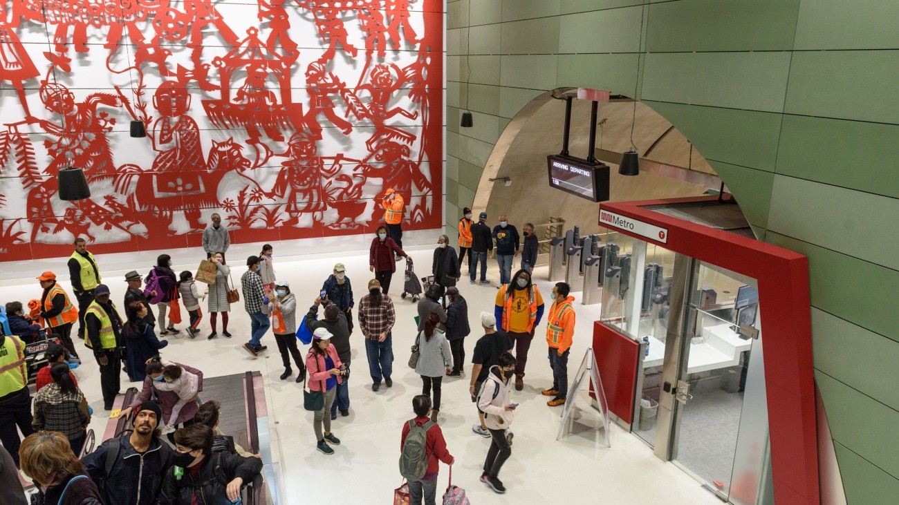 People and artwork at Chinatown's Rose Pak Station