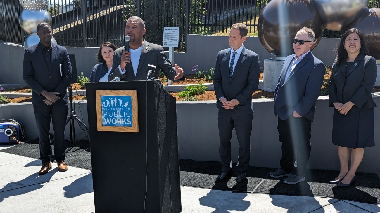 D10 Supervisor Shamann Walton at a podium at the Potrero Gateway ribbon cutting