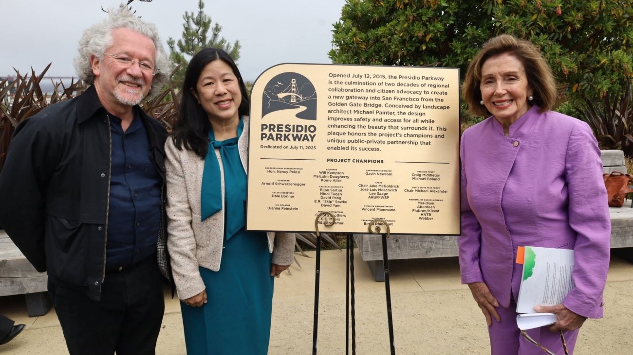 Former SFCTA Executive Director Jose Luis Moscovich, current SFCTA executive Director, and Speaker Emerita Nancy Pelosi standing with gold plaque