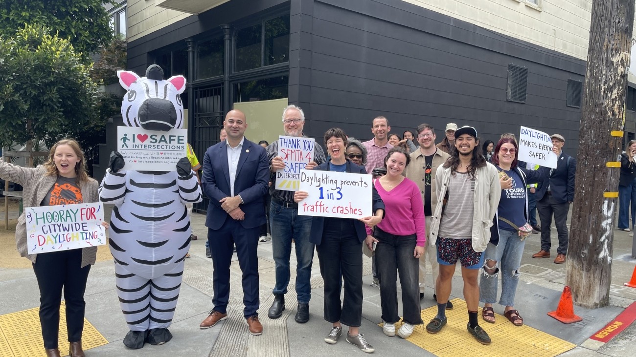 District 5 Transportation Authority Board Member Bilal Mahmood with community leaders and advocates, celebrating the kickoff of daylighting efforts