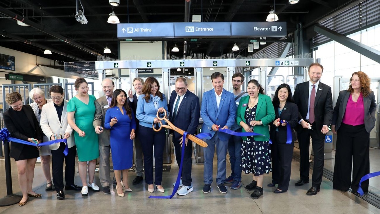 Transportation officials and leaders cutting a ribbon
