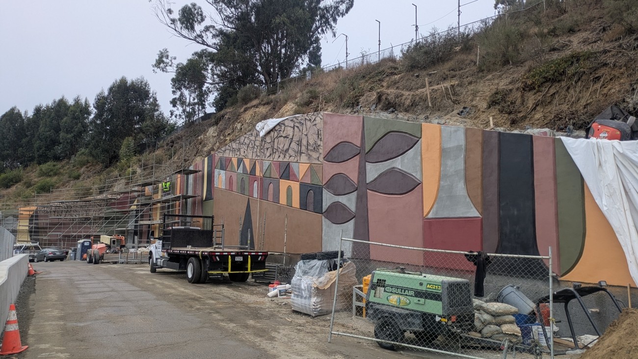 Westside Bridges decorative wall with equipment in foreground 