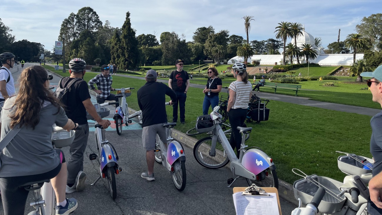 Bike tour participants in front of Conservatory of Flowers