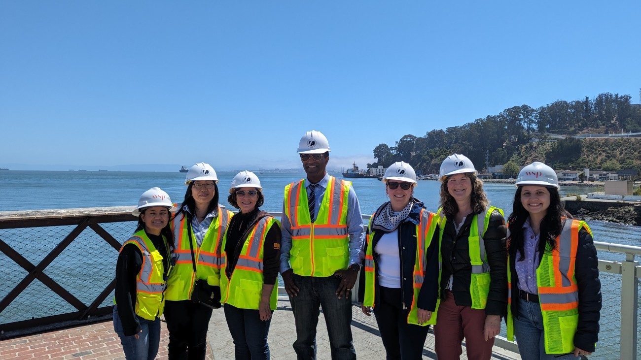 Group shot on pier facing west