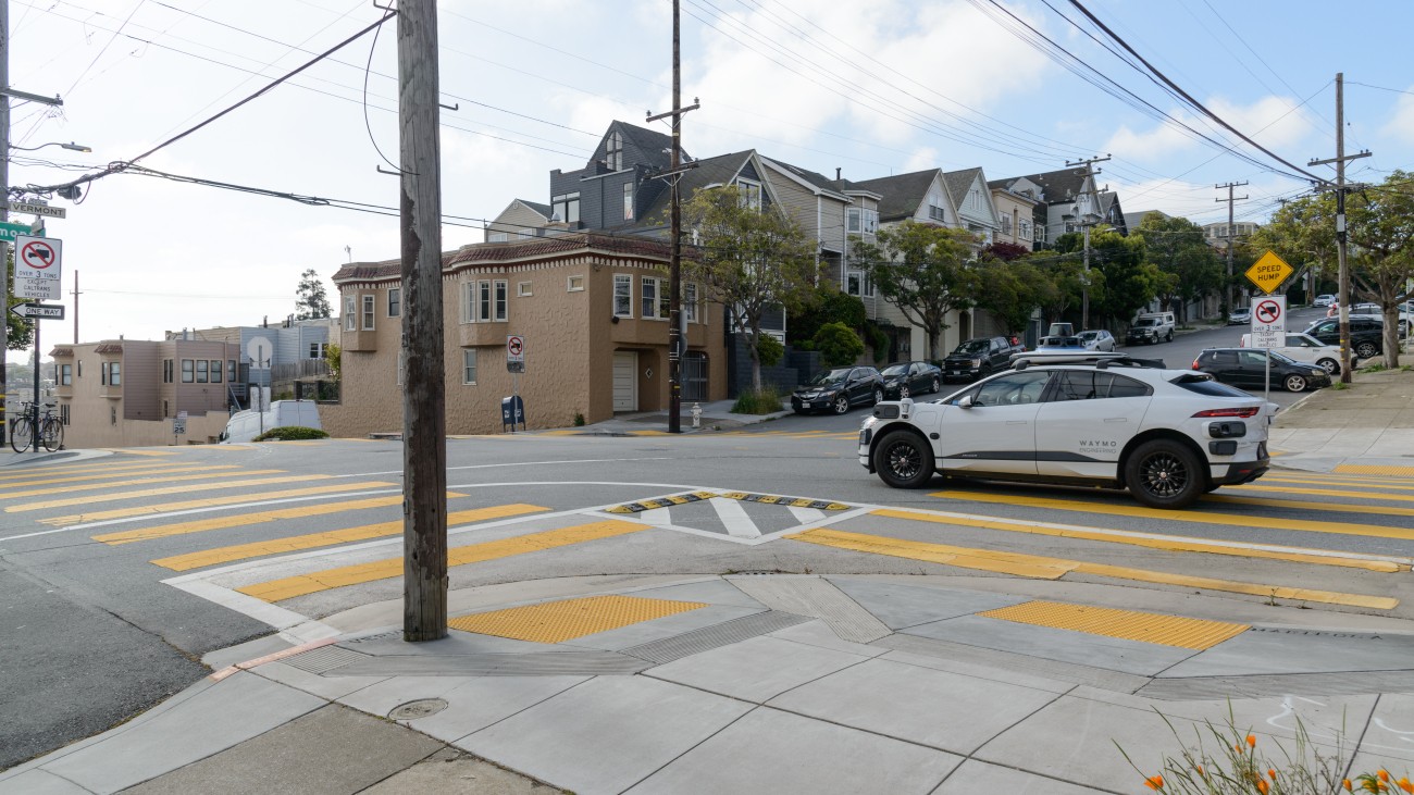 Autonomous Waymo vehicle on the road