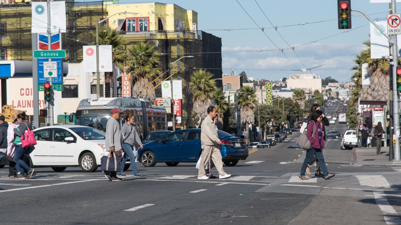 Pedestrians crossing the street on Mission Street 
