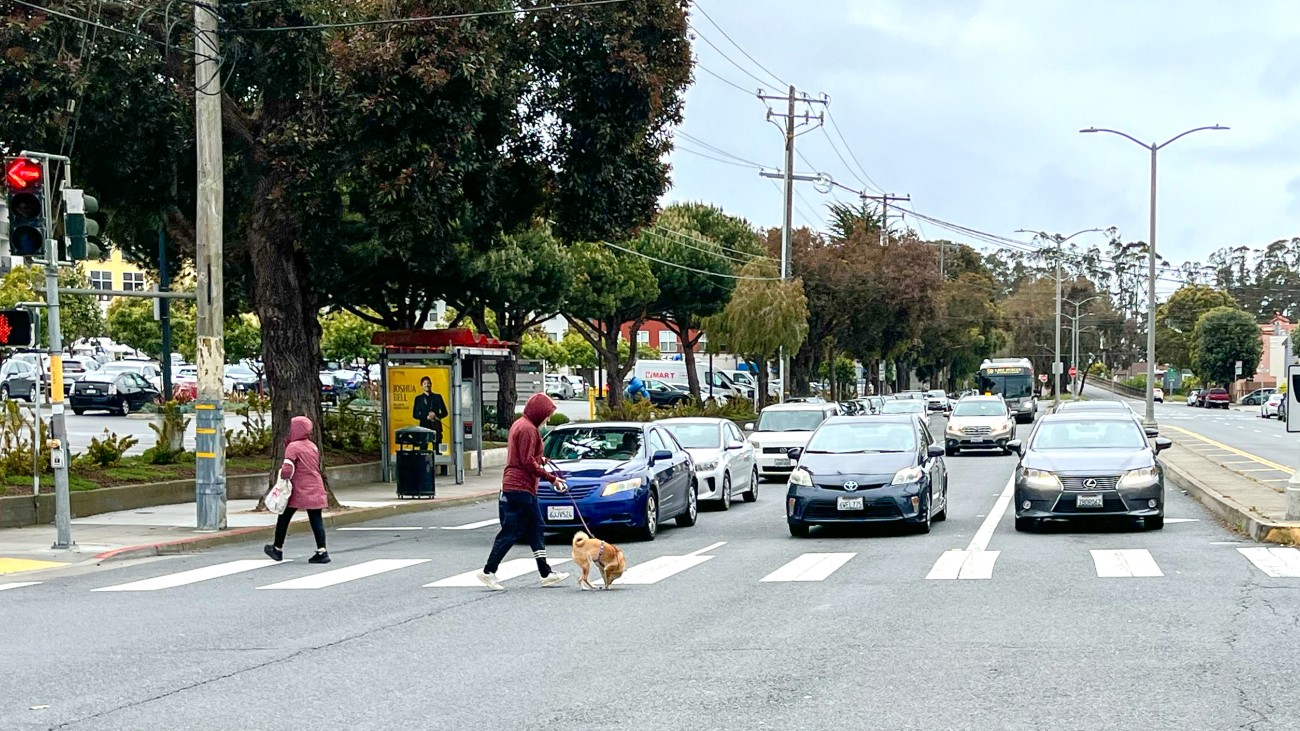 Pedestrians crossing the street at Brotherhood Way 