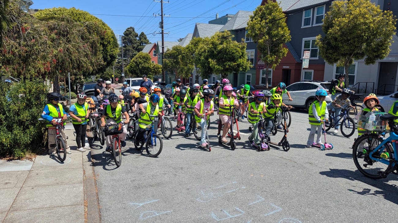 A group of students biking along Page Street