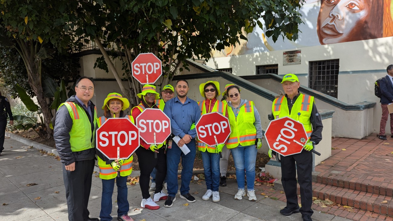 Crossing guards standing in front of a school 