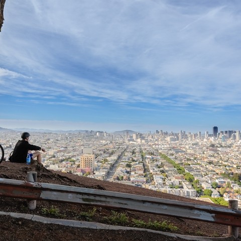 A bicyclist at the Bernal overlook